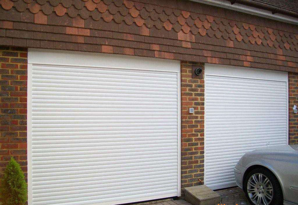 电动车库门和手动门哪个好,车库门用卷帘门好还是不锈钢门好