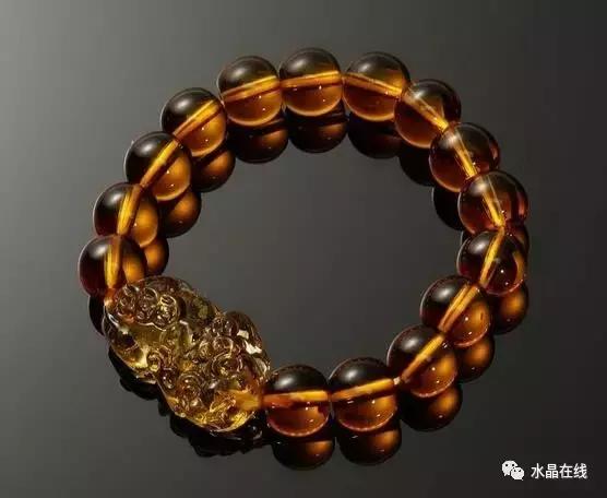 黄水晶千手观音吊坠真假,纯净体黄水晶怎么辨别真假