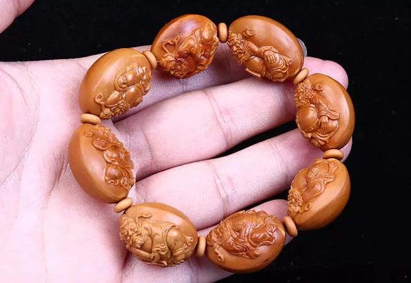 橄榄核雕如何分辨机雕和手修,橄榄核雕有黄斑怎么处理