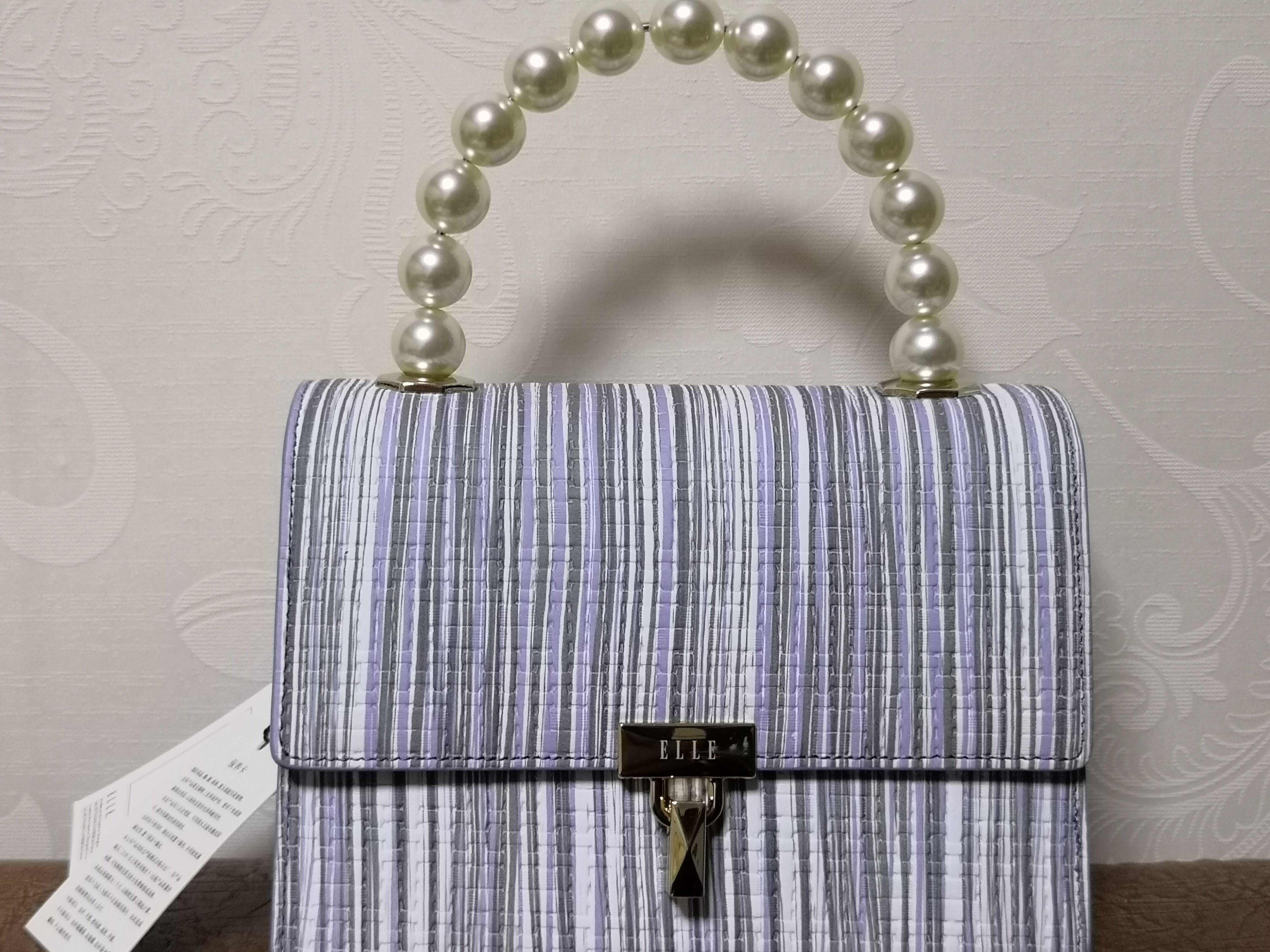 elle粉色包包搭配,elle包包怎么便宜了