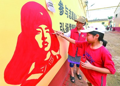 志愿者感受榜样的力量,志愿者在行动送温暖