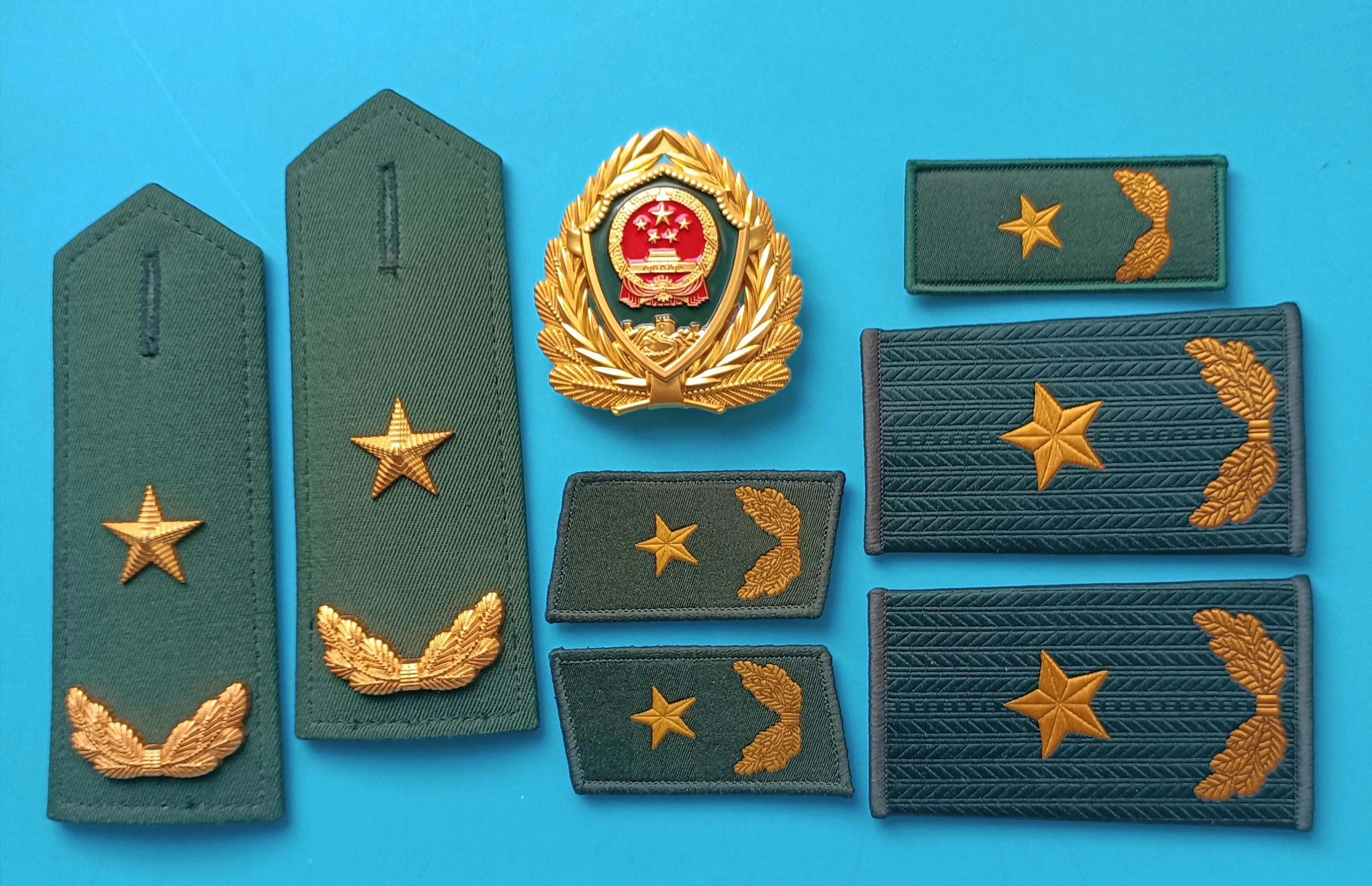 毛启国军装,毛启国警用帽徽