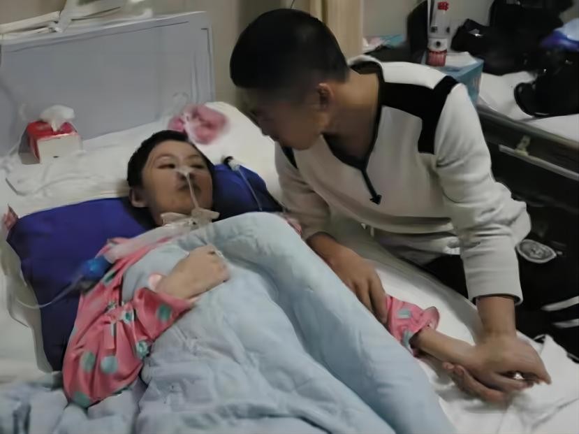 大连男子负债照顾植物人女友,大连男子不离不弃救助植物人女友